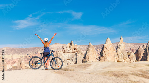 Woman with mountain bike in Turkey, Cappadocia- adventure, sport, travel concept