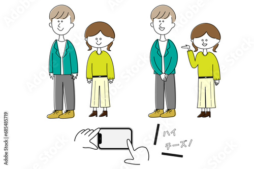 スマホで写真撮影をするカップル