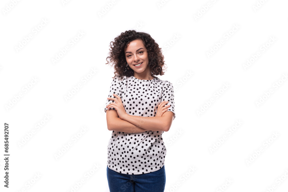 portrait of a slender curly young brunette dressed in a blouse on a white background with copy space portrait of a slender curly young brunette dressed in a blouse on a white background with copy space
