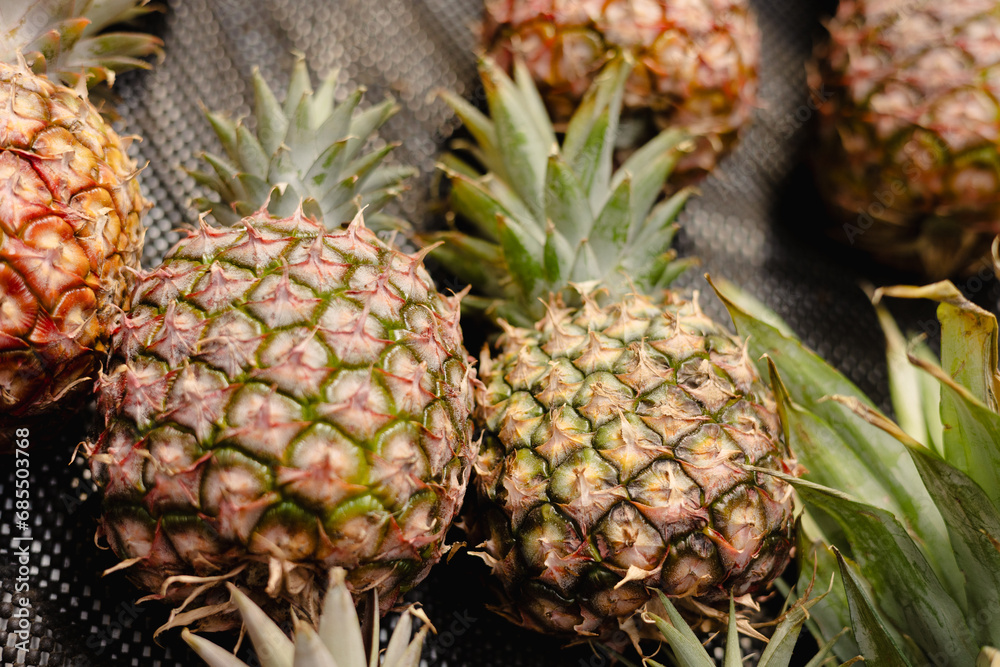 fresh pineapple on the table, fruit market display item fresh pineapple on the table, fruit market display item