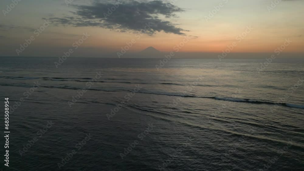 Drone sunset view over the sea with Mount Agung in Bali Drone sunset view over the sea with Mount Agung in Bali