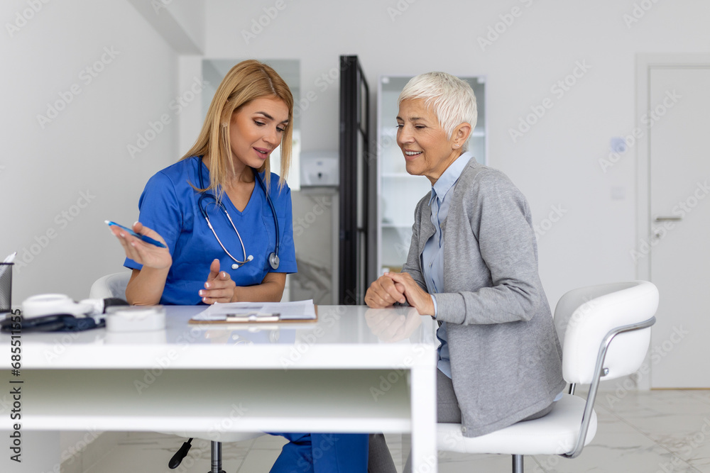 Healthcare and medical concept - doctor with patient in hospital. Doctor working in the office and listening to the patient, she is explaining her symptoms, health care and assistance concept Healthcare and medical concept - doctor with patient in hospital. Doctor working in the office and listening to the patient, she is explaining her symptoms, health care and assistance concept