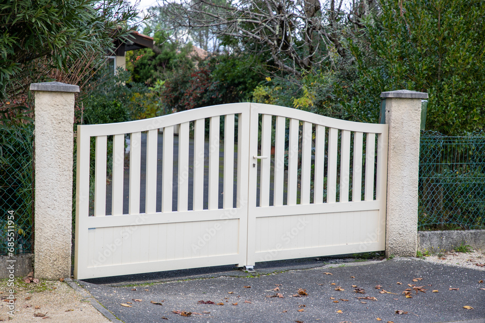 door white steel double gate classic aluminum portal of home suburbs house in street view door white steel double gate classic aluminum portal of home suburbs house in street view