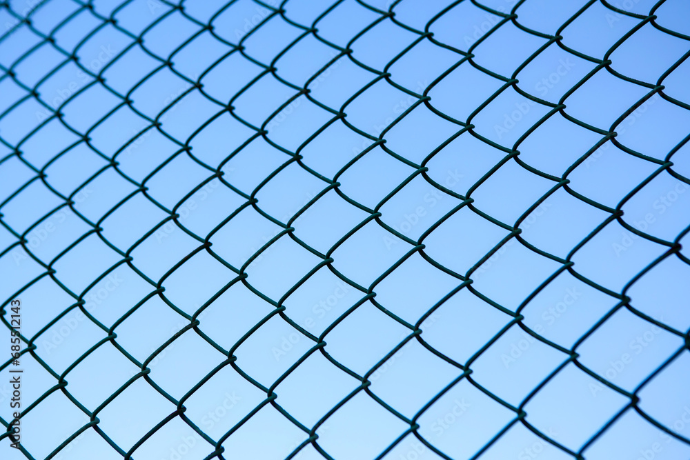 Chain Link Fence against a Clear Blue Sky Chain Link Fence against a Clear Blue Sky
