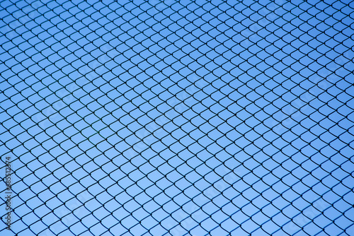 Chain Link Fence against a Clear Blue Sky