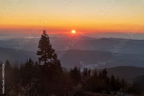 Sunrise from Lysa hora hill in autumn Moravskoslezske Beskydy mountains in Czech republic photo