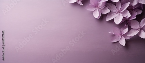 The Japanese-style background of the image showcases a soft and textured purple-colored paper, reminiscent of the material used in traditional Japanese origami.