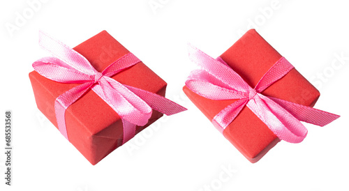 Red gift with pink bow ribbon, isolated on white or transparent background cutout. © Marcela Ruty Romero