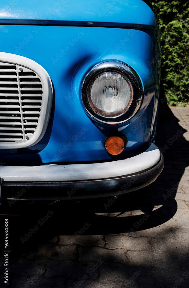 Fragment of a blue retro car close up