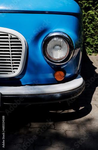 Fragment of a blue retro car close up
