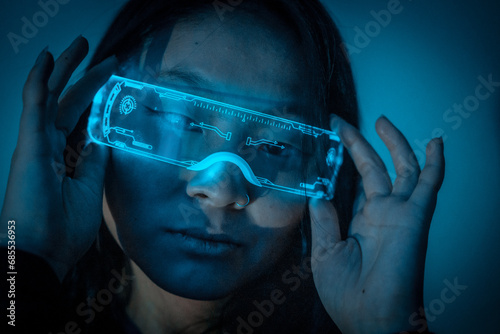 Beautiful young chinese woman wearing futuristic glasses