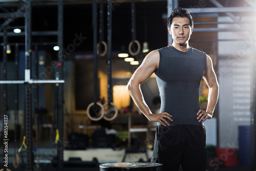Portrait of young man at gym photo