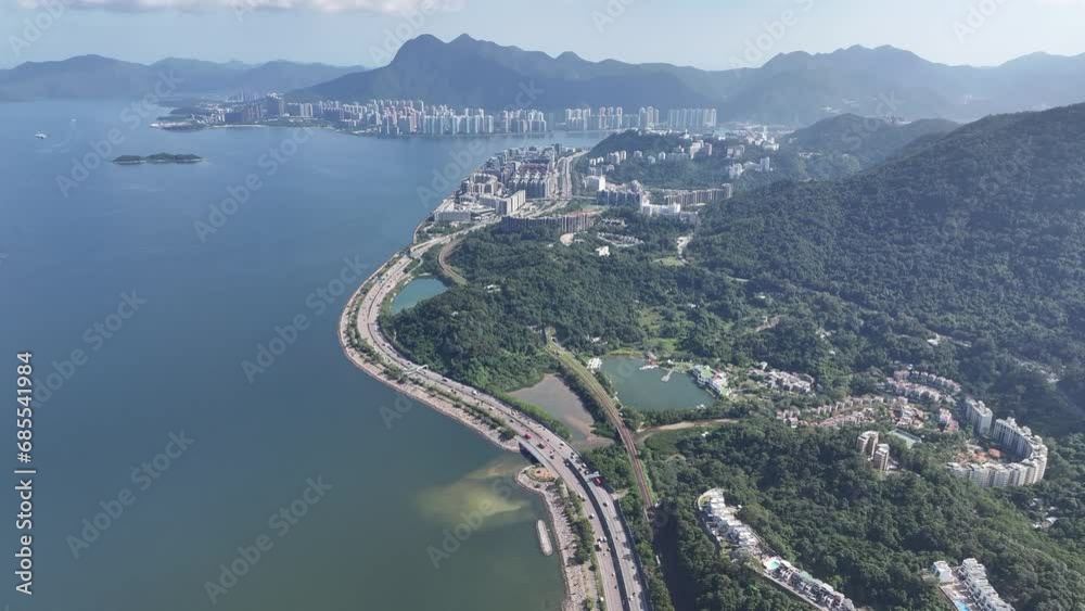 Aerial drone skyview of Tai Po Tai Wo Lam Tsuen River New Territories in Hong Kong Kowloon China fly over the downtown Pak Shek Kok Waterfront Park alongside greening residential town and recreational Aerial drone skyview of Tai Po Tai Wo Lam Tsuen River New Territories in Hong Kong Kowloon China fly over the downtown Pak Shek Kok Waterfront Park alongside greening residential town and recreational
