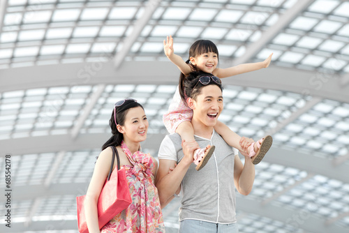 Cheerful young family at the airport