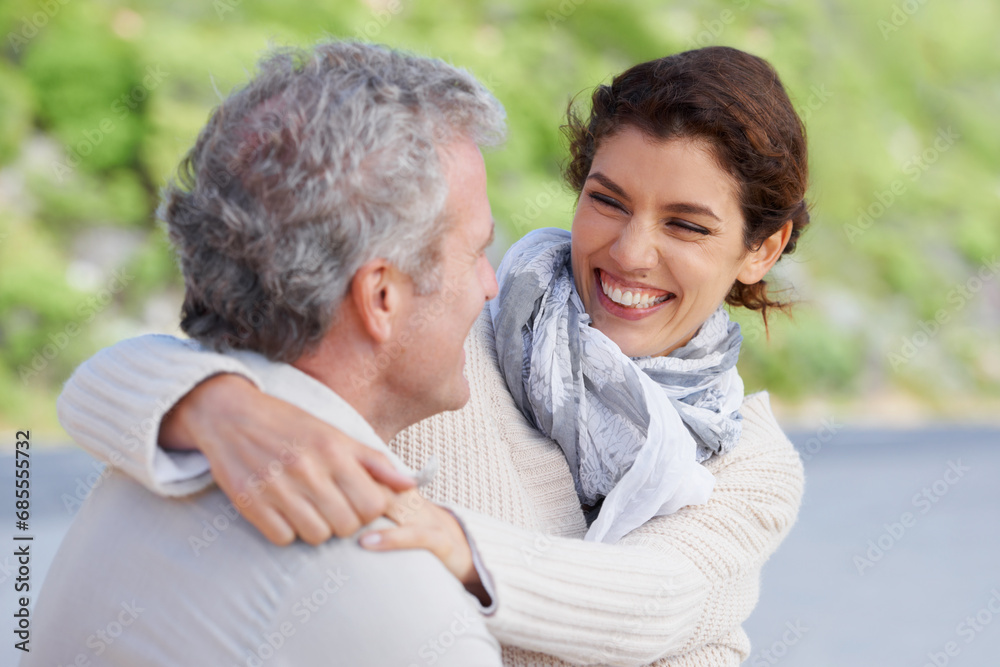Couple, face or laughing outdoor and hug for romance, love or relationship in nature for date at beach. Mature, man and woman or embrace with happy, relax and trust for bonding, honeymoon or support Couple, face or laughing outdoor and hug for romance, love or relationship in nature for date at beach. Mature, man and woman or embrace with happy, relax and trust for bonding, honeymoon or support