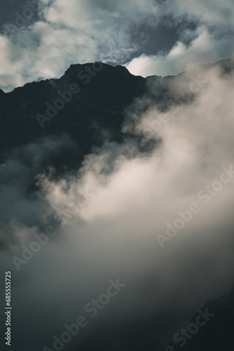 Spectacular and amazing beautiful panorama of the Andes Mountains in the Colca Canyon, Peru. Natural compostion with beautiful luminous white clouds. Mystery atmosphere.
