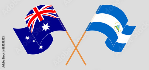 Crossed and waving flags of Australia and Nicaragua