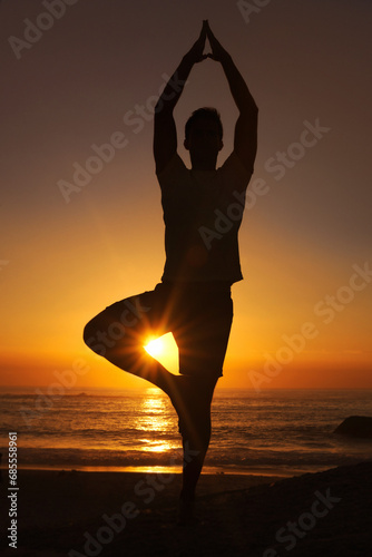 Silhouette, man and praying with hands for yoga, health and wellness on beach with sunset and zen. Person, shadow and pilates or namaste for balance, mindfulness and healthy body by ocean or sea