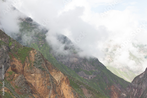 Spectacular and amazing beautiful panorama of the Andes Mountains in the Colca Canyon, Peru. White clouds, wonderful cloudscape. Cliff, blue sky. HDR photo