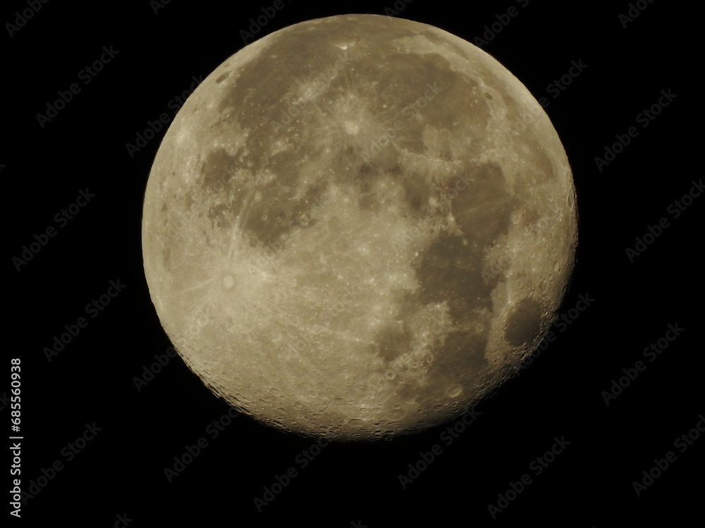 Super moon with craters on a black background. Close-up Super moon with craters on a black background. Close-up