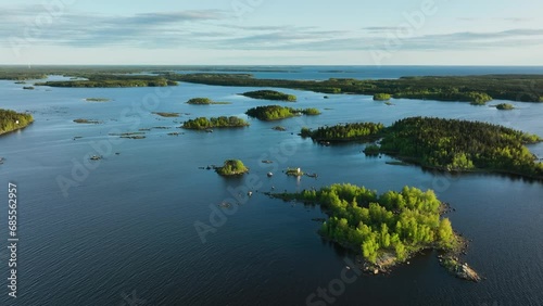 Drone shot of lush green islands in the archipelago of Finland, summer sunset photo