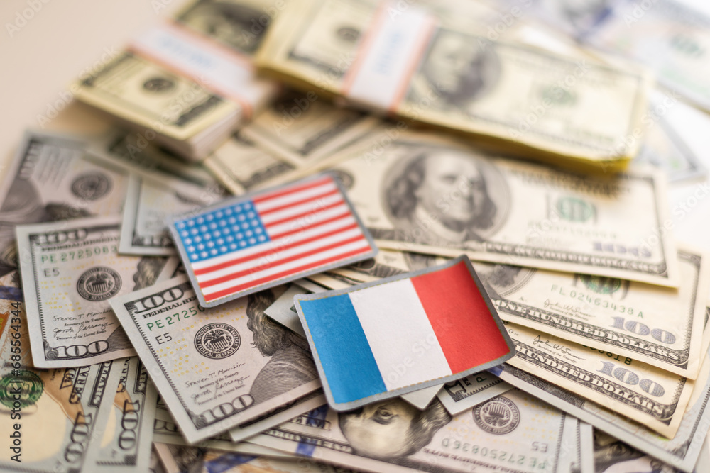 France flag with US dollars as background. Concept for investors, soft focus France flag with US dollars as background. Concept for investors, soft focus