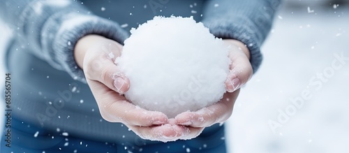 Woman holding snowball prep...
