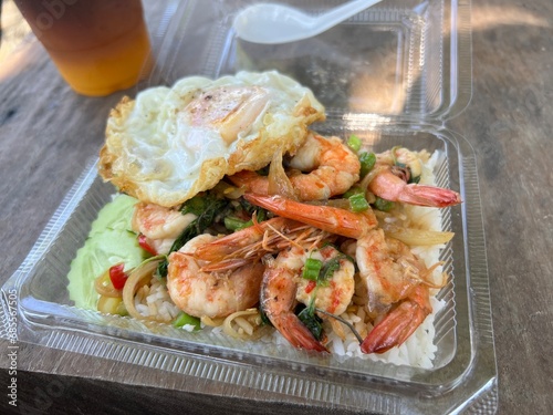 Fried Shrimp with Basil Leaves and fried egg box set lunch food.