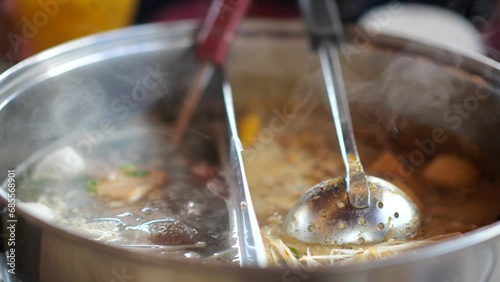 Shabu Shabu or Sukiyaki. Japanese Food. Shrimp on boiling pot in a Japanese restaurant. Enjoy eating Shabu Shabu and Sukiyaki in hot pot at Japanese restaurant. Selective focus. photo