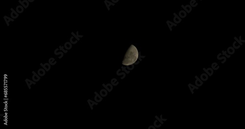 Faded waxing moon in the night sky, moon texture