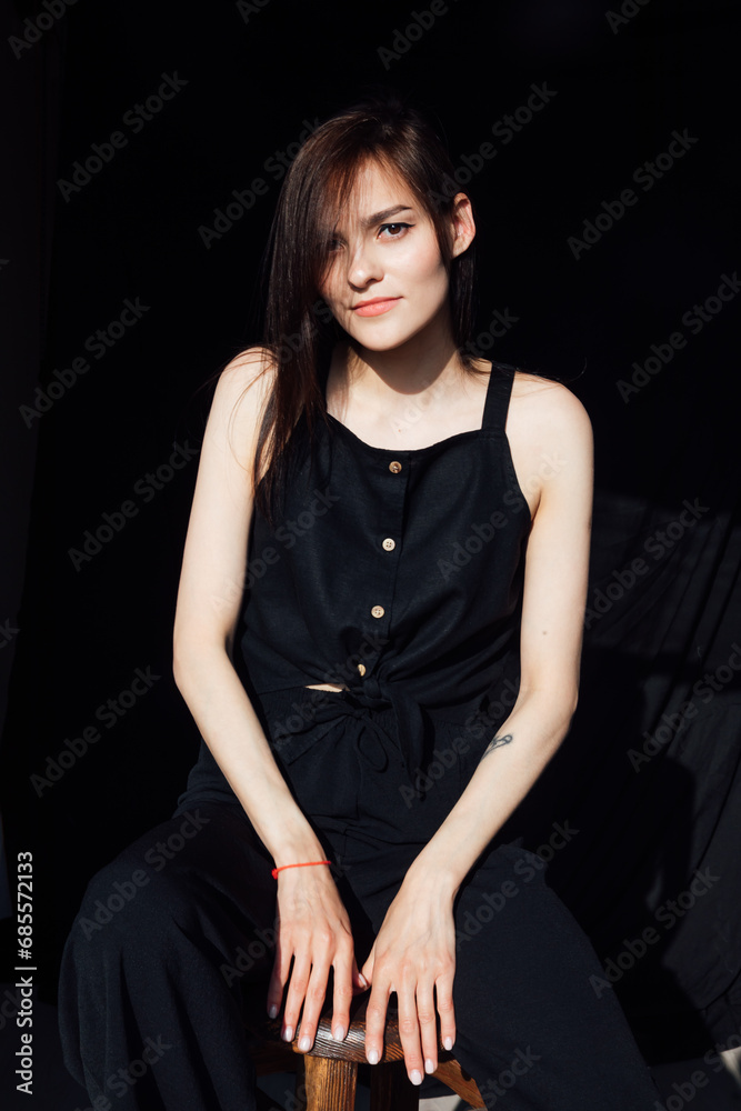 Portrait of a beautiful thin young woman in black clothes Portrait of a beautiful thin young woman in black clothes