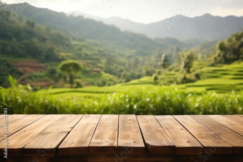 empty wooden table top for product display montages with blurred rice terraces background © Anastasia YU