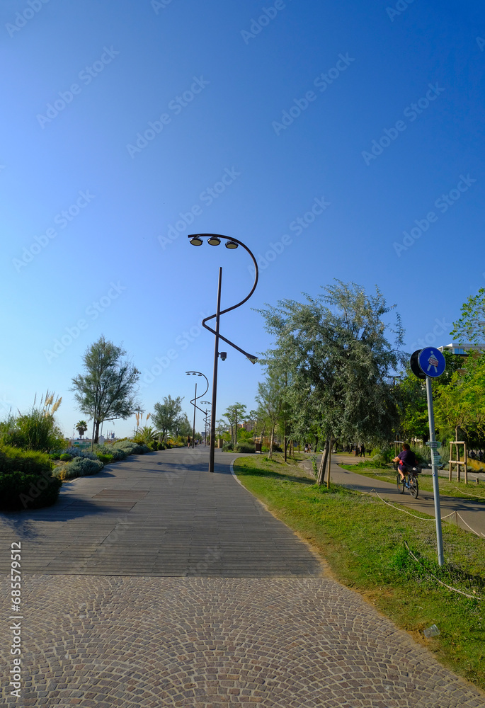 Adriatic promenade in Rimini, Emilia-Romagna with street lamps in the shape of the letter R on a sunny day