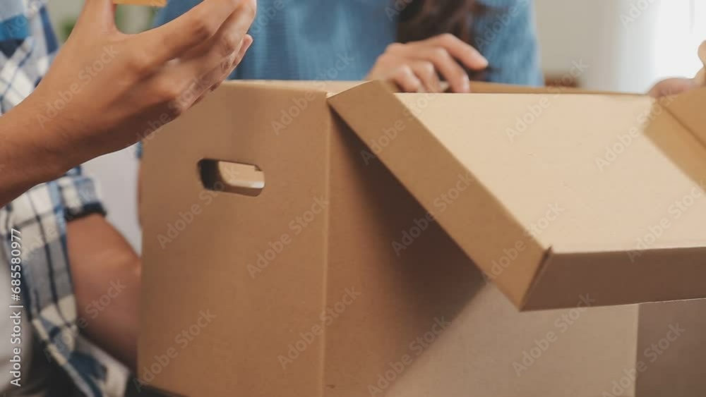 Startup small business SME, Entrepreneur owner using smartphone or tablet taking receive and checking online purchase shopping order to preparing pack product box. Selling online ideas concept Startup small business SME, Entrepreneur owner using smartphone or tablet taking receive and checking online purchase shopping order to preparing pack product box. Selling online ideas concept