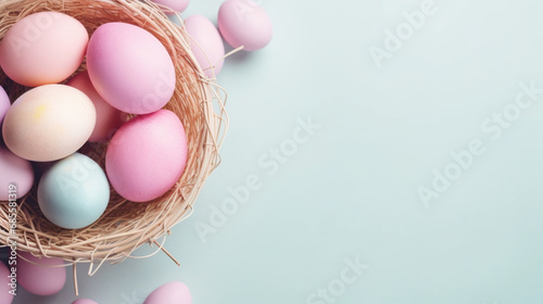 Easter eggs in a basket on the blue background. Stylish tender spring template with space for text. Greeting card or banner