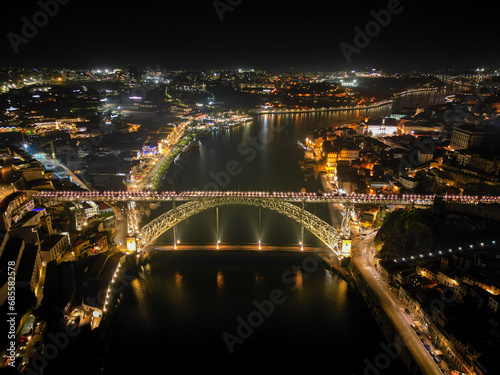 Portugal, Porto, Ponte Luis I Bridge, night aerial photo from drone