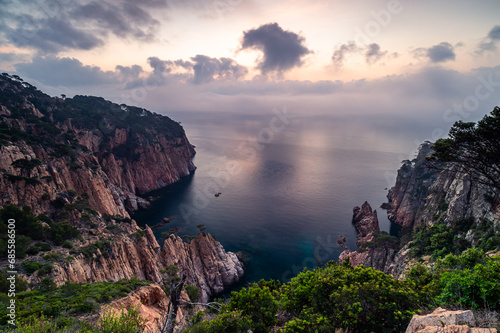 Sunrise on the rocky coastline (Tamariu, Costa Brava, Mediterranean Sea, Spain)