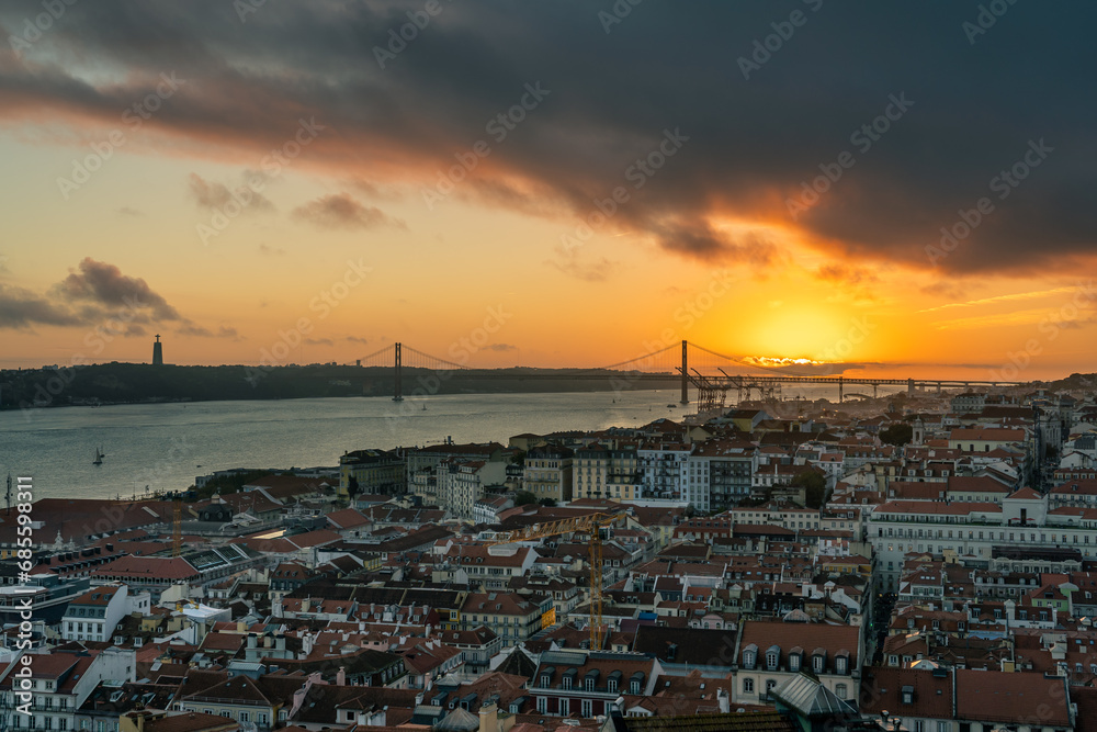 Sunset in Lisbon, April 25 Bridge under golden sky