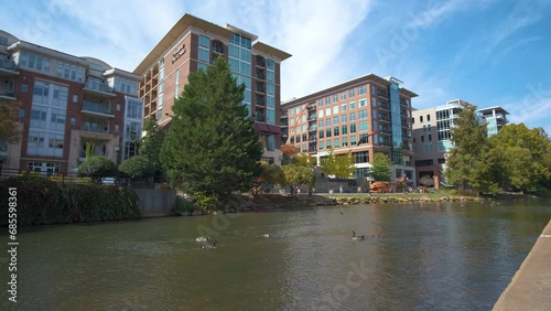 Downtown architecture of Greenville city in South Carolina. View of the Reedy River and apartment buildings. American travel destination. photo