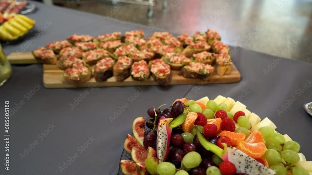 Tray with variety of Canapes: traditional snacks or appetizers for parties, events, and cocktails, served before the main meal at formal receptions. Tray with variety of Canapes: traditional snacks or appetizers for parties, events, and cocktails, served before the main meal at formal receptions.