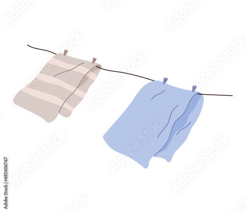 Washed clothes, towels dry outside on stretched rope. Clothing and garment care, housekeeping concept. Professional cleaning of apparel. Drying laundry on clothesline isolated on white background