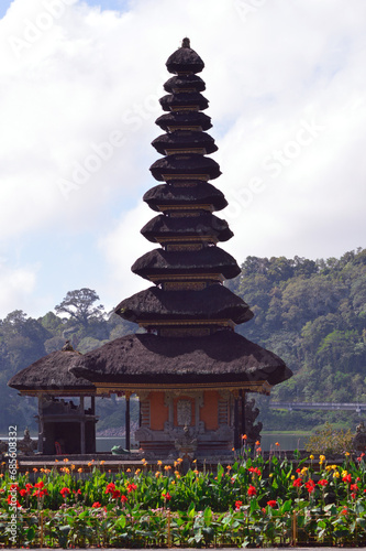 Portrait View Of Balinese Ethnic Multi-tiered Meru Temple Buildings Surrounded By Flower Gardens On The Shores Of Lake Beratan At Bedugul, Bali