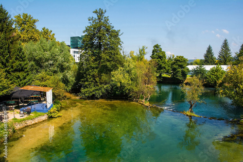 A river side bar on the banks of the River Una as it passes through central Bihac in Una-Sana Canton, Federation of Bosnia and Herzegovina. Viewed from Most Alije Izetbegovica Bridge photo