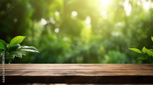 Empty wooden table on blur abstract green from garden in the morning background.For montage product display or design key visual layout
