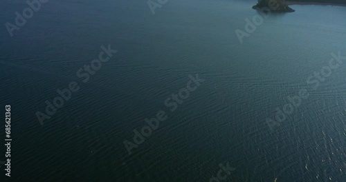 4k Drone Tilt up to Rocky Mountains Lake