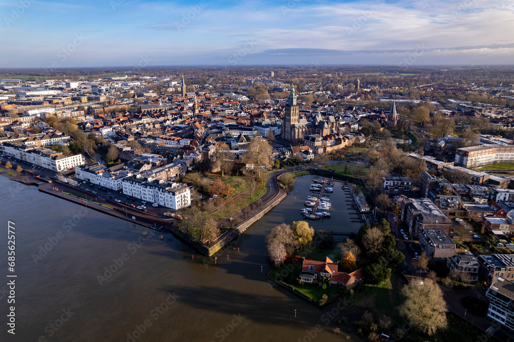 Boulevard countenance seen from above during high water levels of river IJssel in Zutphen, The Netherlands, in the morning. Aerial weather and climate concept.