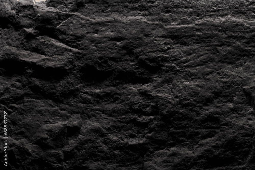 Obraz premium Black stone texture, dark abstract background. Natural mineral rock close up details, empty backdrop with copy space for design
