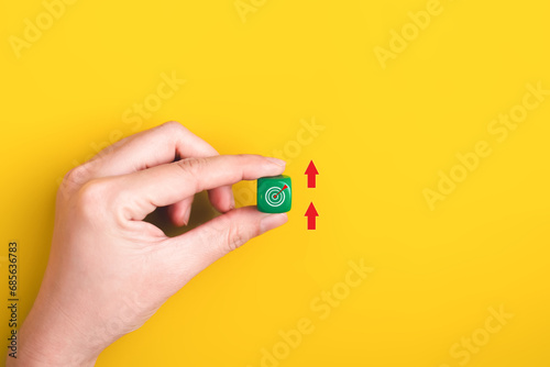 Hand holding green block of target goal, Successful project plan, Business strategy planning management, Business goal on magnifying glass, New project plan of company