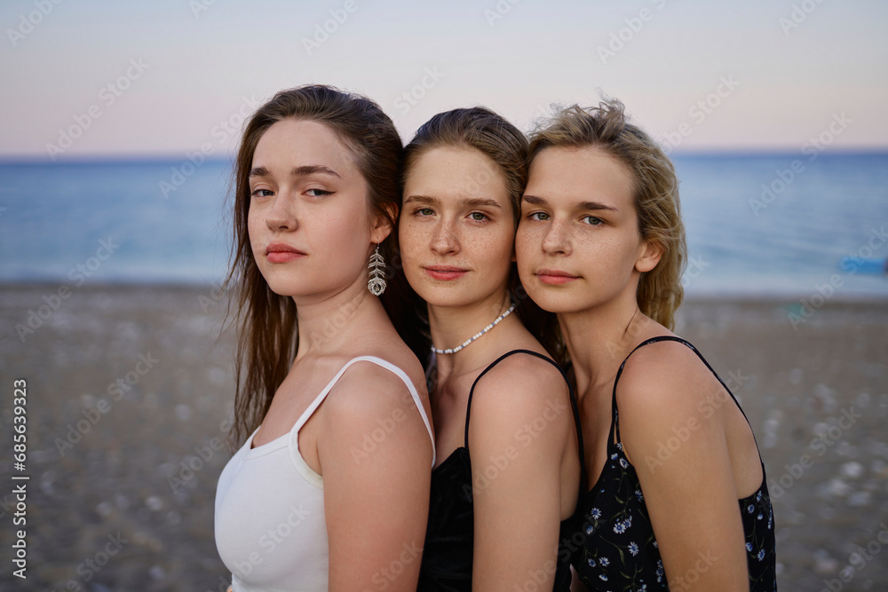 Confident women at beach on vacation Confident women at beach on vacation