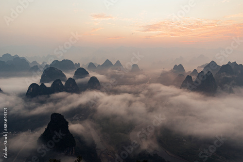 Mountain peaks with clouds at sunrise, Guilin, China photo